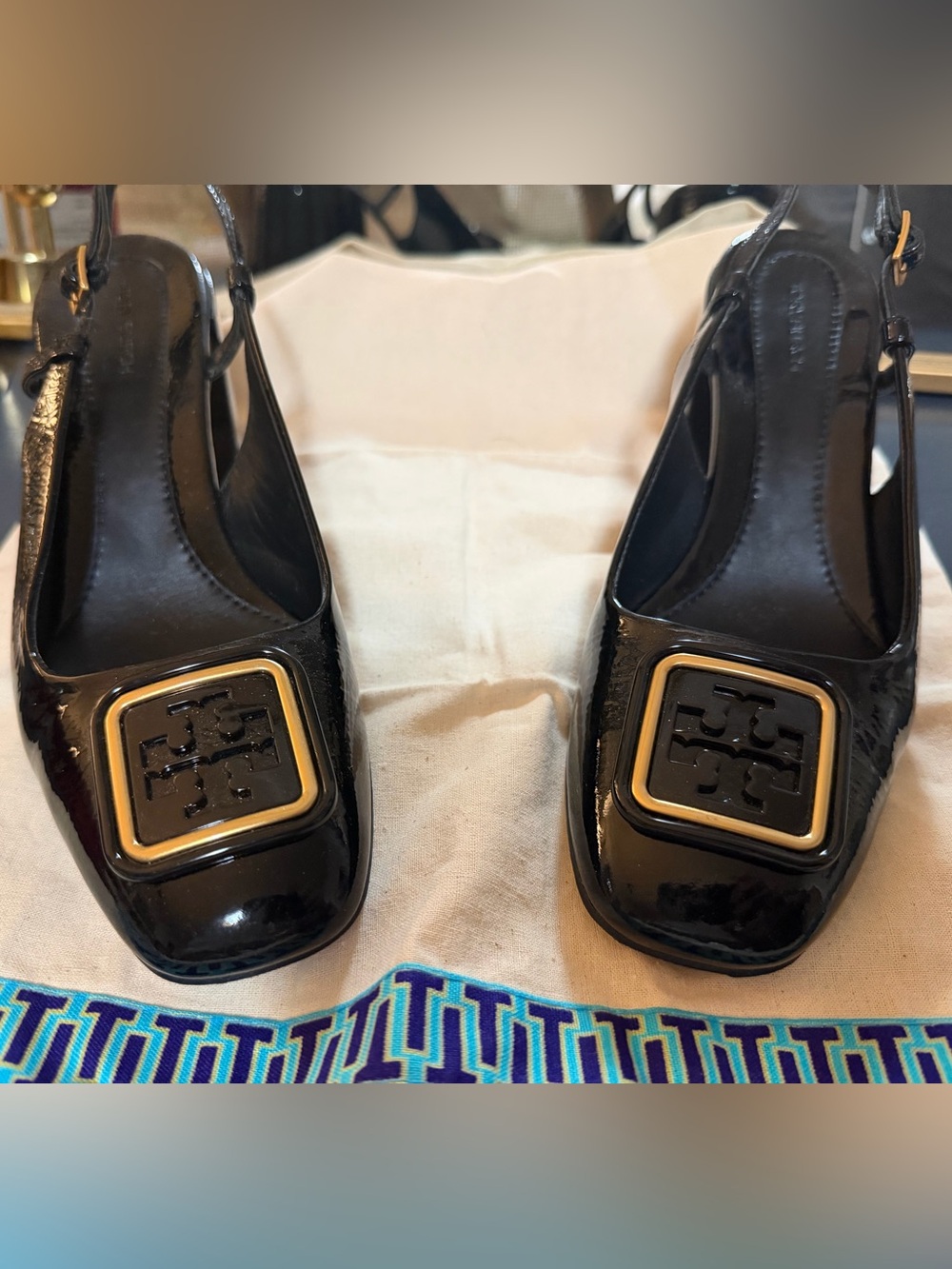 Tory Burch Black Patent Leather Slingback Pumps with Gold-Tone Logo Plaque